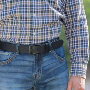 Delta Force Belt. Man wearing a black genuine leather belt with wide pin carbon fiber buckle, 